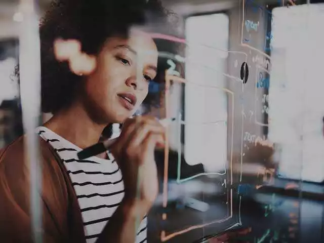 CMI Research woman working on data diagram